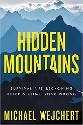 Wejchert - Hidden Mountains, Survival and reckoning after a climb gone wrong - yellow text on image of impressive, peaky, blue mountains reaching the clouds