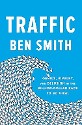 Smith - Traffic: Genius, rivalry, and delusion in the billion dollar race to go viral - title in white on a blue background with a wave of computer mouse arrow icons pointing towards the subtitle.